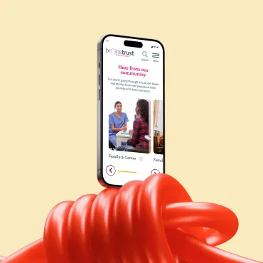 Mobile phone mockup up balancing on a red elastic knotted string.