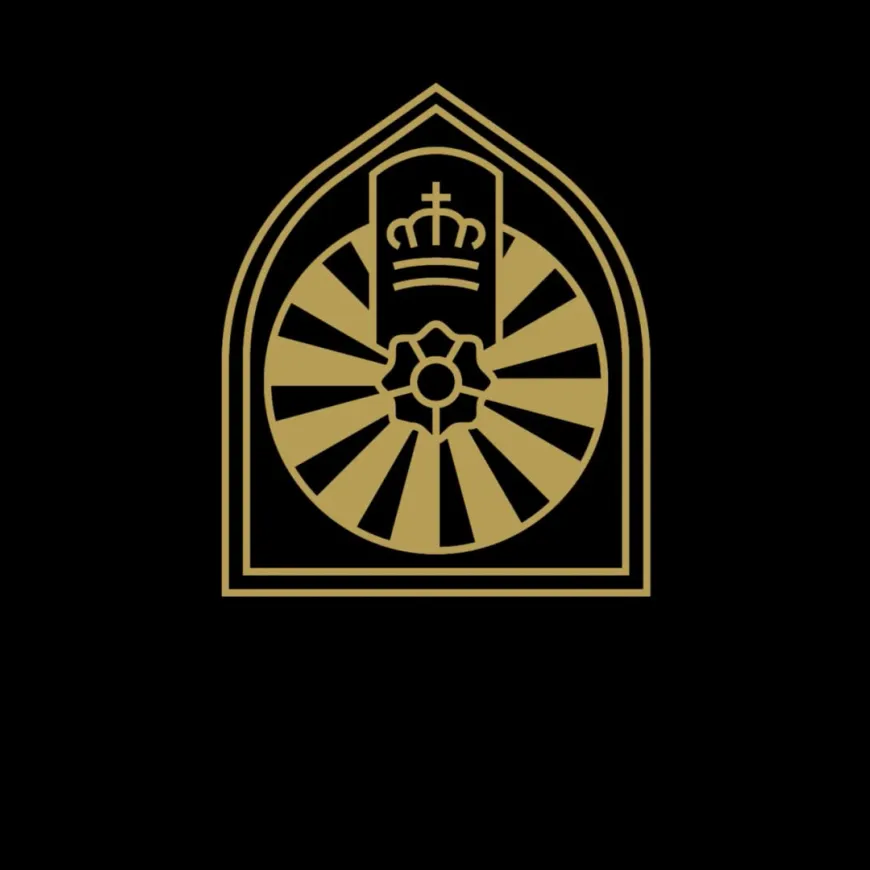 a black background featuring a round table logo in gold