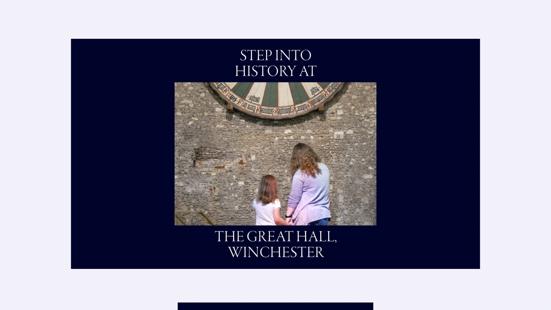 a dark blue screen with the words step into history at the great hall winchester featuring a mother and child