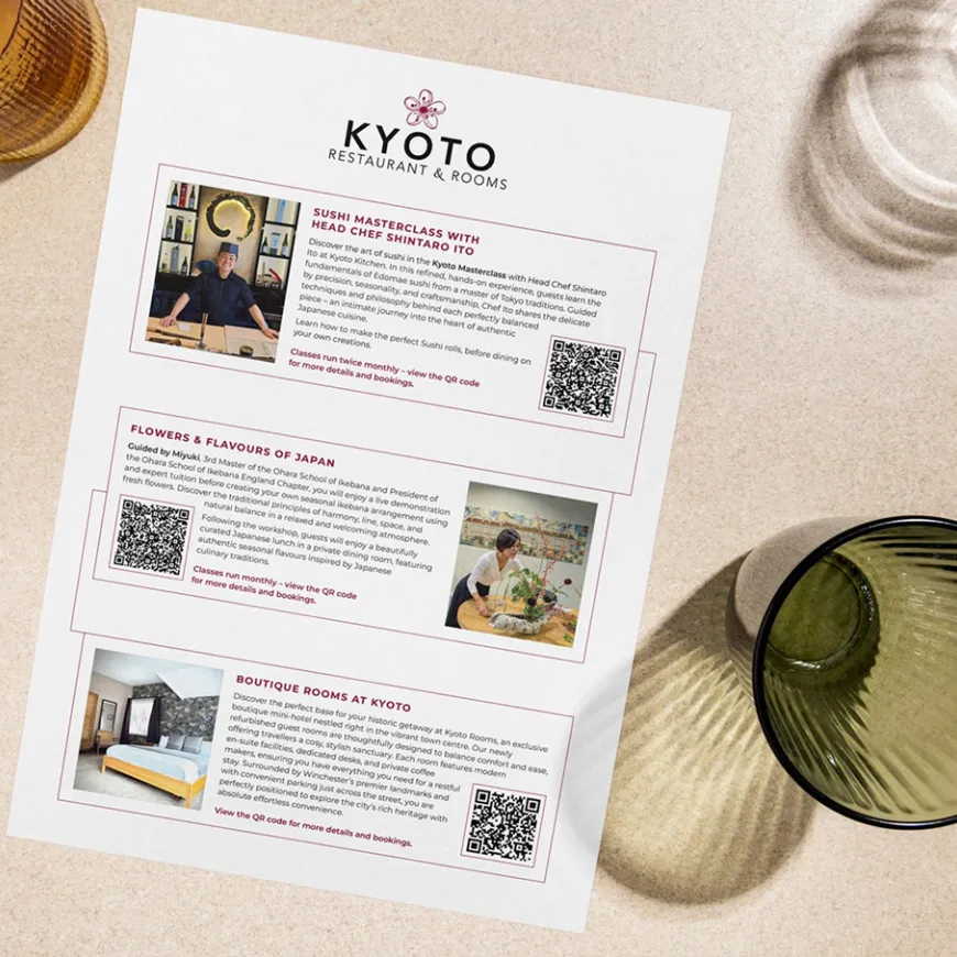 Kyoto A4 extra classes and sessions advertising poster on a dinner table with glasses.
