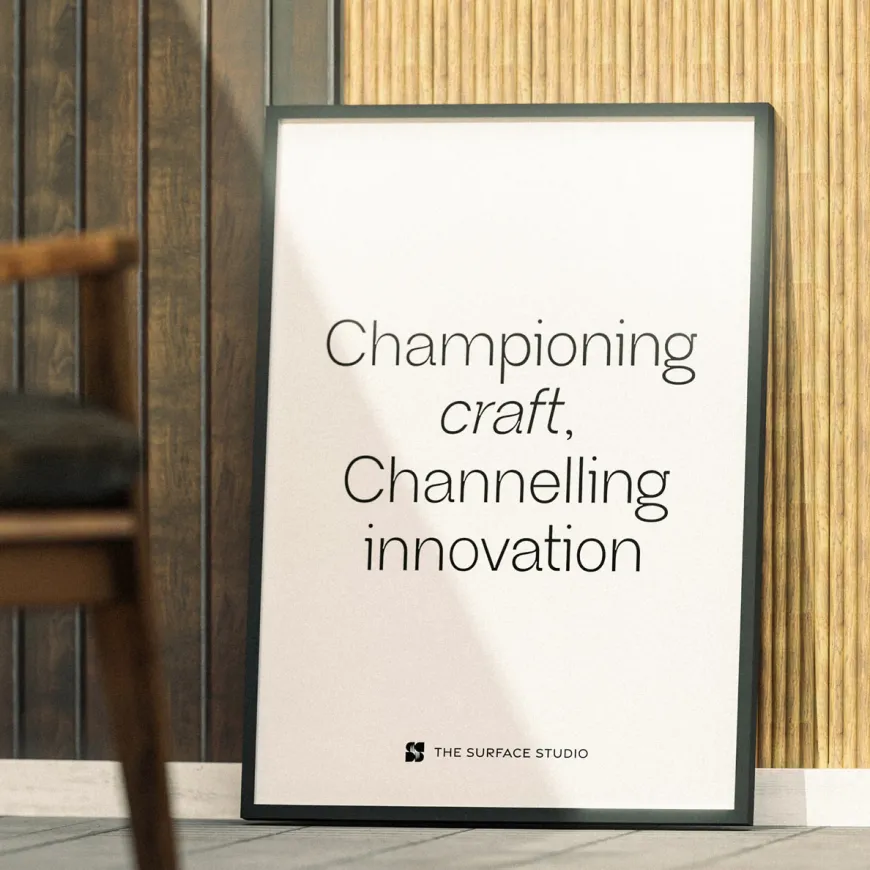 Poster leaning against a wall with the text “Championing craft, Channeling innovation"