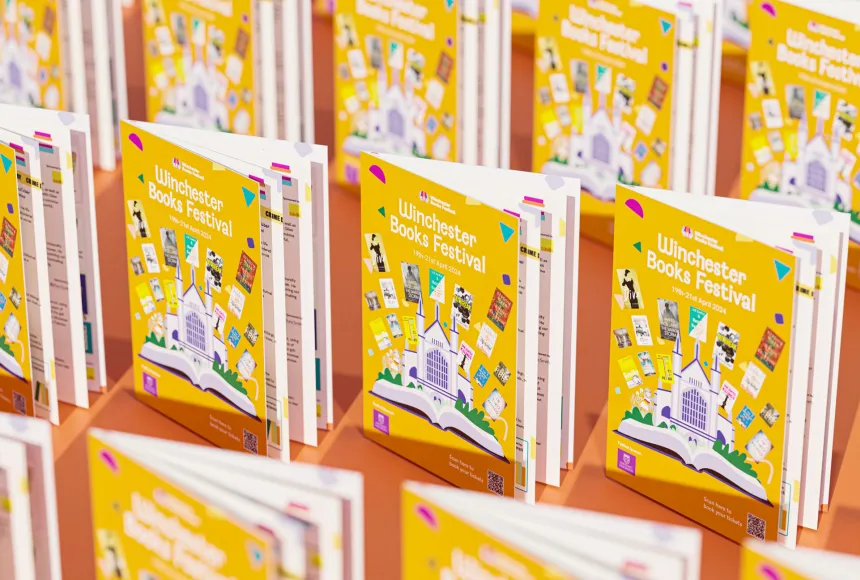 Multiple Winchester books festival booklets stood open repeating rows