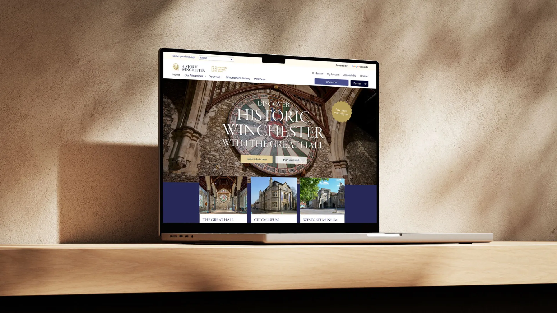 a homepage render on a laptop of the historic winchester website